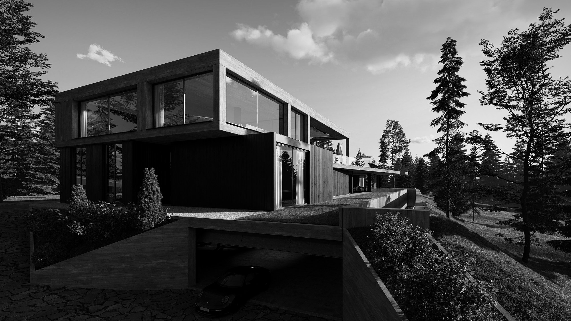 Einfahrt zur unterirdischen Garage mit Grasdach und Terrasse